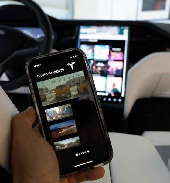 Concept image of a Tesla mobile app accessing Sentry Mode footage